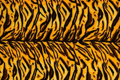 Texture fabric of tiger for background Stock Photos