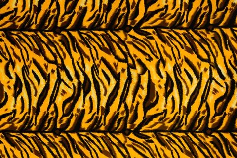 Texture fabric of tiger for background Stock Photos