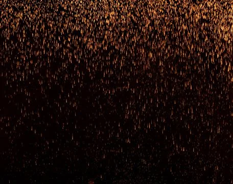 The texture of the fall of gold particles Stock Photos