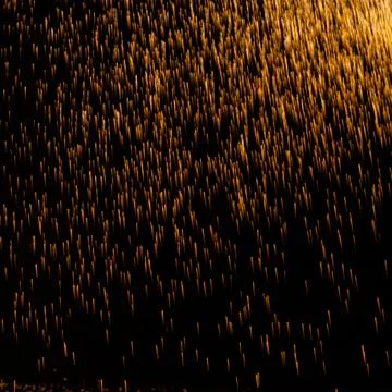 The texture of the fall of gold particles Stock Photos