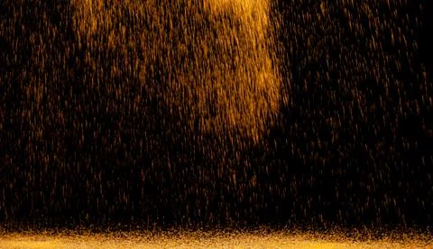 The texture of the fall of gold particles Stock Photos