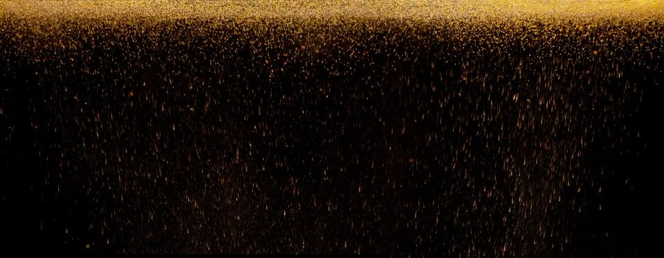 The texture of the fall of gold particles Stock Photos