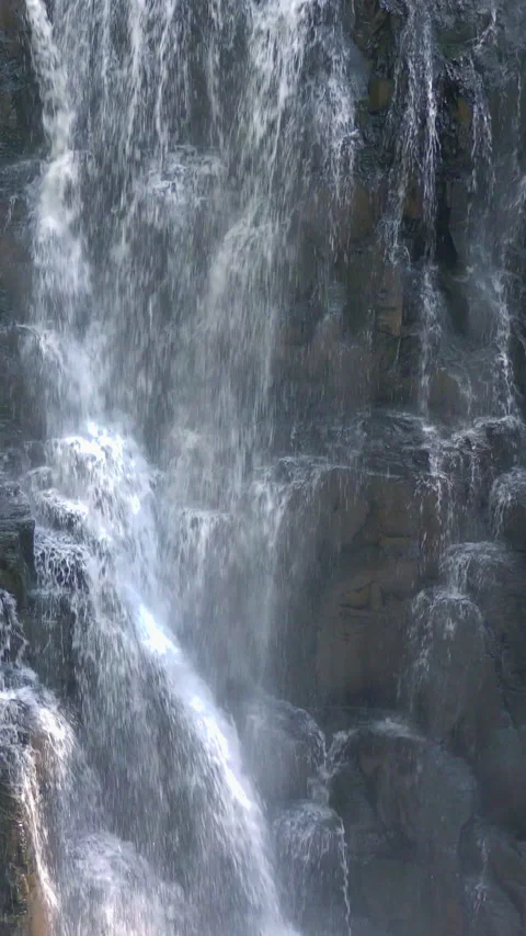 Texture of Falling Water on Dark Rock Vertical Video Stock Footage 346195326