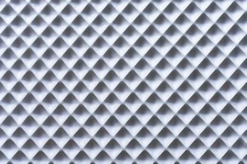 The texture features a repeating pattern of diamond shapes with raised edges. Foto stock