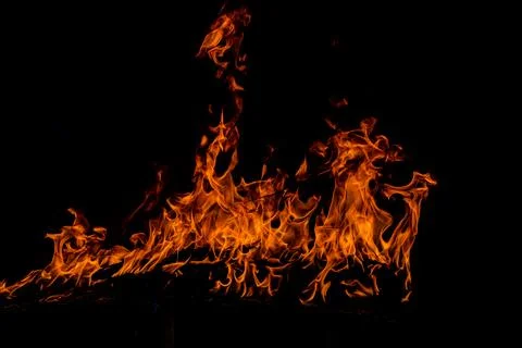 Texture of fire on a black background. Abstract fire flame background, large Stock Photos