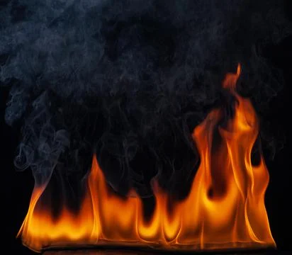 Texture of fire on a black background . Stock Photos