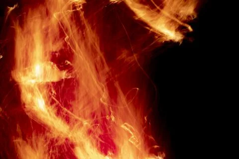 Texture of fire. Flames in night. Burning firewood. Stock Photos
