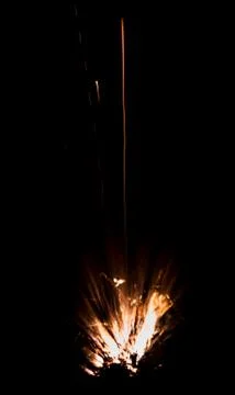 The texture of a firearm shot , a bright flash of flame on a black background Stock Photos