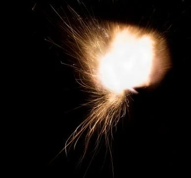 The texture of a firearm shot , a bright flash of flame on a black background Stock Photos