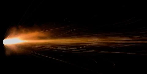 The texture of a firearm shot , a bright flash of flame on a black background Stock Photos