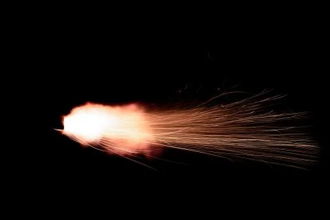 The texture of a firearm shot , a bright flash of flame on a black background Stock Photos