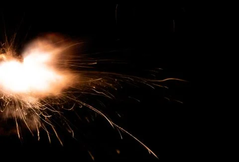 The texture of a firearm shot , a bright flash of flame on a black background Stock Photos
