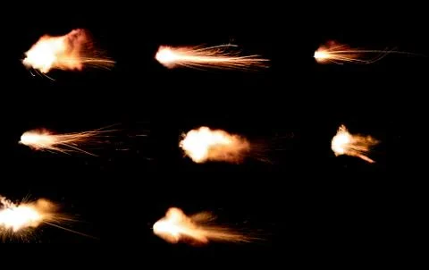 The texture of a firearm shot , a bright flash of flame on a black background Stock Photos