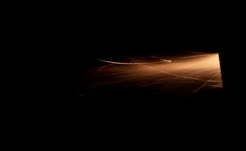 The texture of a firearm shot , a bright flash of flame on a black background Stock Photos