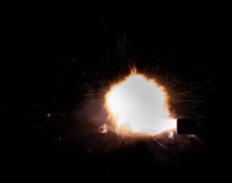 The texture of a firearm shot , a bright flash of flame on a black background Stock Photos