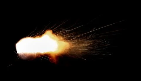 The texture of a firearm shot , a bright flash of flame on a black background Stock Photos