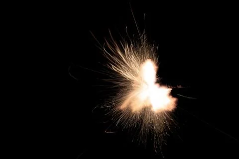 The texture of a firearm shot , a bright flash of flame on a black background Foto stock