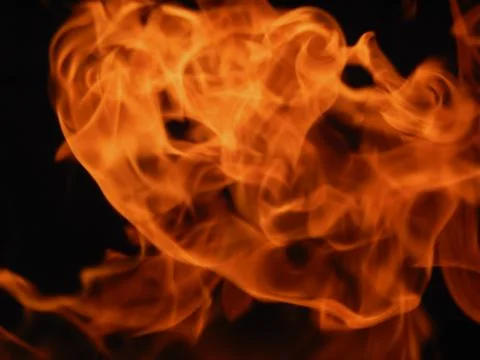 The texture of a flame of fire on a black background Stock Photos
