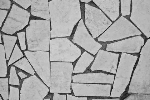 The texture of flat marble blocks of different sizes of light color. Stock Photos