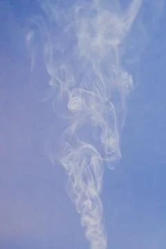 Texture of flowing smoke on blue background. Foto stock