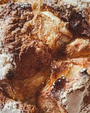 Texture of fluffy bread with crispy crust. Stock Photos