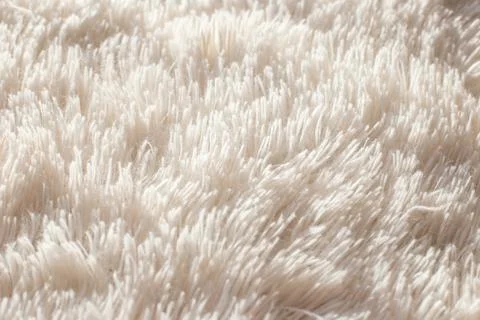 Texture of fluffy white artificial plaid, close up Stock Photos