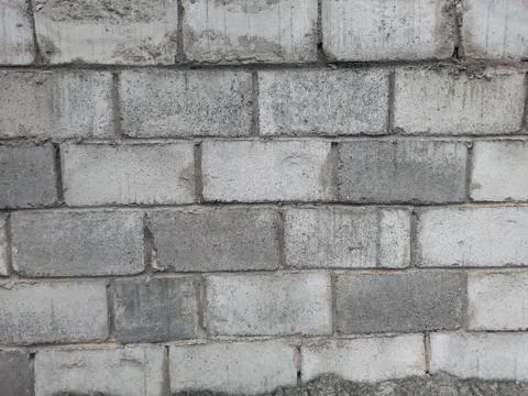Texture of foam blocks. Gray, dark gray wall of blocks. Stock Photos