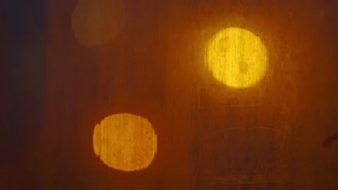 The texture of a fogged window with warm lights of lanterns in the background Stock Footage 194114607