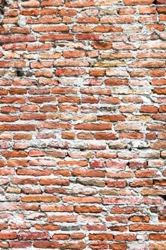 Texture formed by an old brick wall. Stock Photos