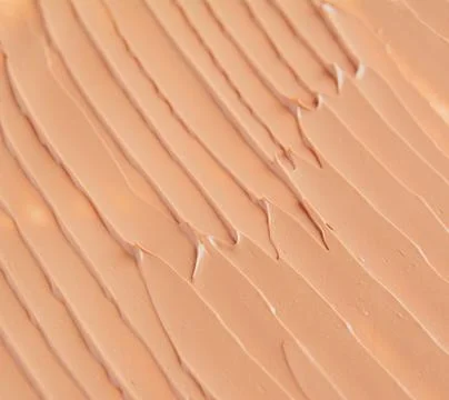 The texture of the foundation is beige under the make-up Stock Photos