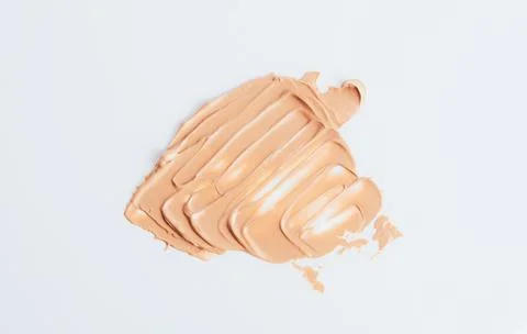 The texture of the foundation is beige under the make-up Stock Photos