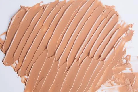 The texture of the foundation is beige under the make-up Stock Photos