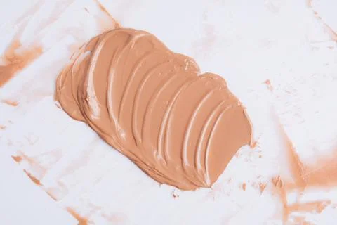 The texture of the foundation is beige under the make-up Stock Photos