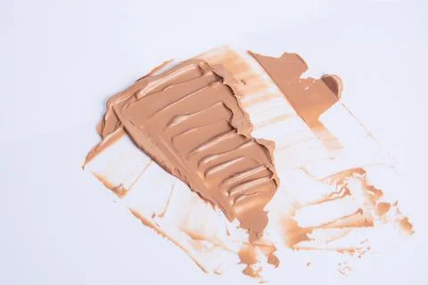 The texture of the foundation is beige under the make-up Stock Photos