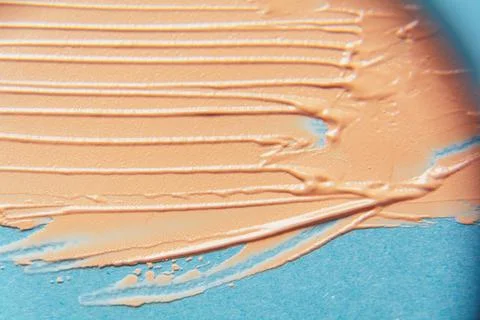 The texture of the foundation is beige under the make-up Stock Photos