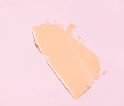 The texture of the foundation is beige under the make-up Stock Photos
