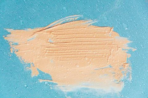 The texture of the foundation is beige under the make-up Stock Photos