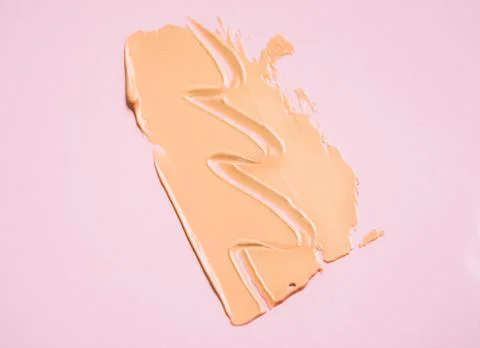 The texture of the foundation is beige under the make-up Stock Photos