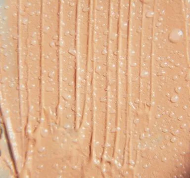 The texture of the foundation is beige under the make-up Stock Photos