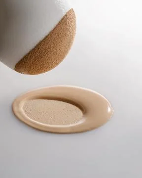 The texture of the foundation with a trace of sponge. Stock Photos