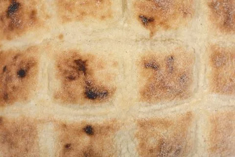 Texture of a fresh flatbread with a grid pattern. Foto stock