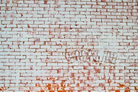Texture of full wall of brick straight on of white and red with arch Foto stock