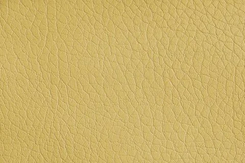 Texture of genuine leather or artificial synthetic leatherette yellow color.. Stock Photos