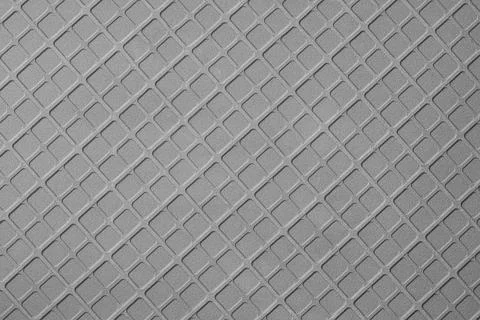 Texture of geometric pattern on metallic surface. Stock Photos