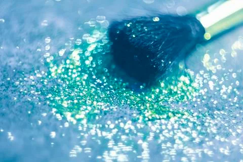 Texture of gold glitter on the makeup brush Stock Photos