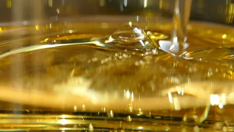 Texture with golden bubbles. Liquid yellow background. Sunflower oil Stock Footage 104371579