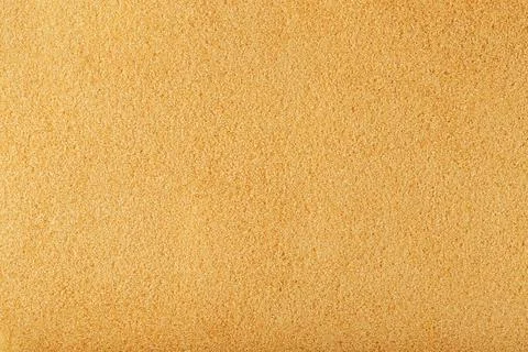 Texture of golden sand on the beach with a solid background in full screen Foto stock