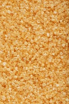 Texture of golden sand on the beach with a solid background in full screen Stock Photos