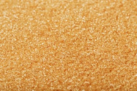 Texture of golden sand on the beach with a solid background in full screen Foto stock