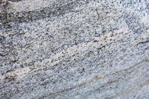 The texture of the granite stone is light gray in color, background Stock Photos